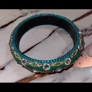 Jeweled gold and turquoise bangle for the carefree fancy side of yourself.